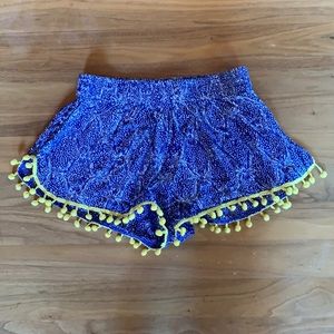 Blue shorts with yellow tassels